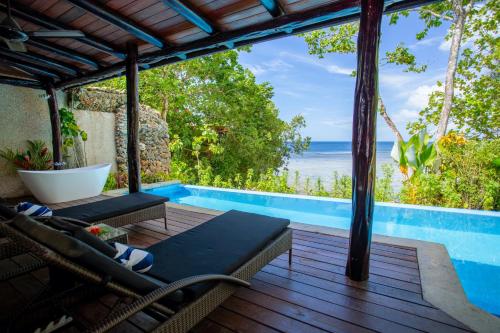 a view of the ocean from the deck of a villa at Savasi Island Resort in Savusavu