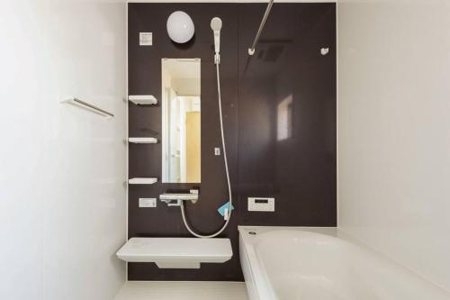 Salle de bains dans l'établissement ゆうゆう布佐駅新築戸建Free Wifi