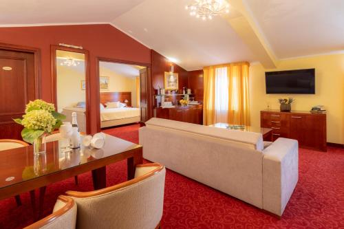 a large living room with a couch and a table at Villa Riva in Makarska