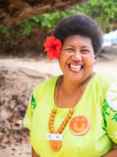 a woman with a red flower in her hair at Savasi Island Resort in Savusavu