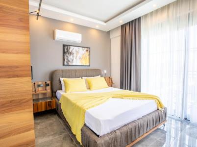 Ένα ή περισσότερα κρεβάτια σε δωμάτιο στο Villa Mayura