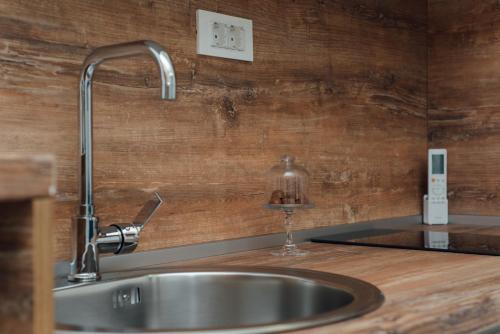 a kitchen sink with a faucet on a counter at La Mer Apartments Kotor in Kotor