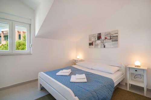 Ένα ή περισσότερα κρεβάτια σε δωμάτιο στο Daniel's Apartments Split