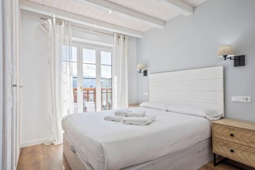 Llit o llits en una habitació de Luderna - Apartamento con terraza Mirador Salardu