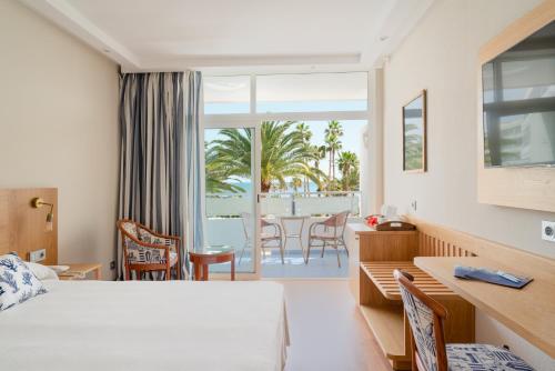 a hotel room with a view of the ocean at VIK Hotel San Antonio in Puerto del Carmen