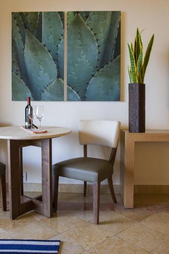 a dining room with a table and a chair at Grand Fiesta Americana Los Cabos All Inclusive Golf & Spa in Cabo San Lucas