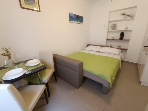 Säng eller sängar i ett rum på Zadar Beach