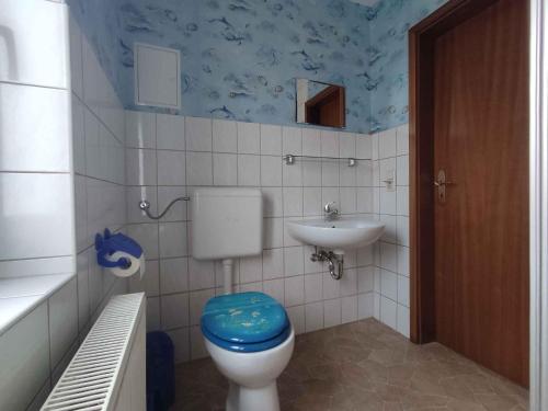 a bathroom with a toilet and a sink at Studio in Ribnitz-Damgarten 36833 in Ribnitz-Damgarten