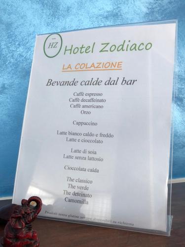 a sign for a hotel zocalo with a menu at Hotel Zodiaco in Bolsena