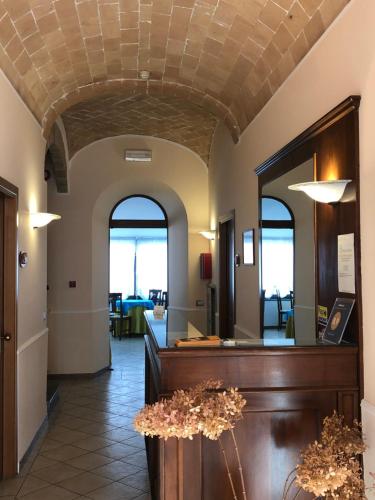 a lobby with a reception desk in a building at Hotel Zodiaco in Bolsena