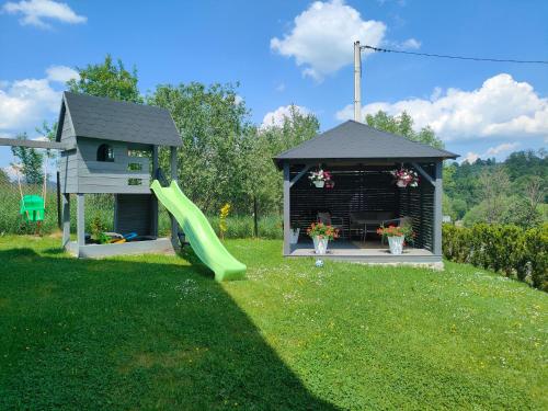 a playground with a slide and a gazebo at Willa Rychlina in Zakopane