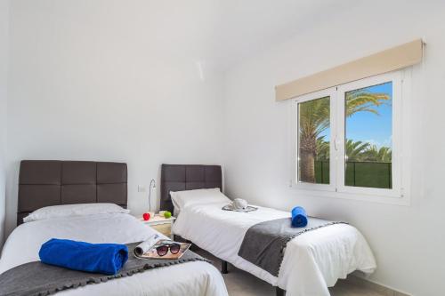 Posteľ alebo postele v izbe v ubytovaní Villa Kikay by Villa Plus