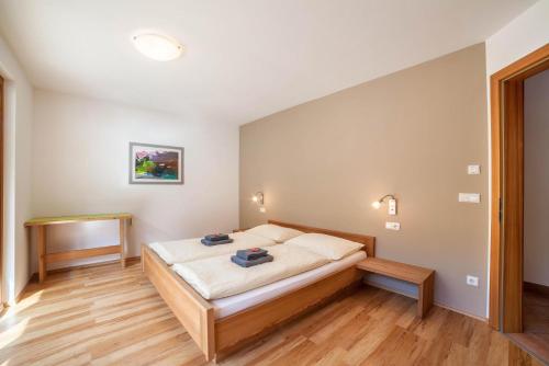 a bedroom with a bed in a room at Pritscheshof Ferienwohnung Terrasse in Malles Venosta