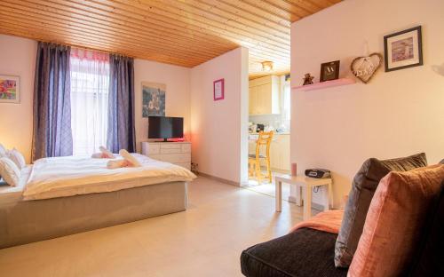 a bedroom with a person laying on a bed at Haus Padrun, Apartment nr.6 in Arosa