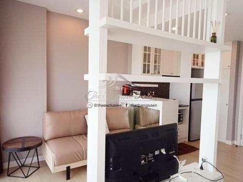 a living room with a loft bed and a tv at Seaview Secret with Wifi n Toproof Pool @ Bangsaen in Bangsaen