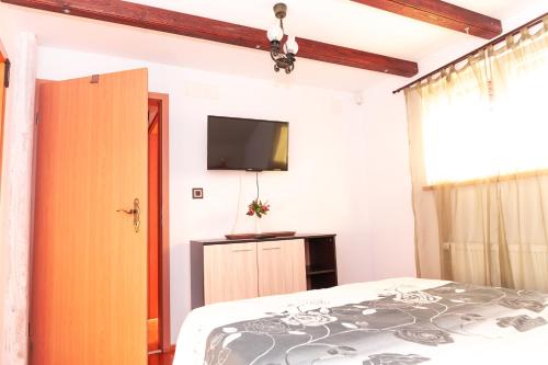 Postel nebo postele na pokoji v ubytování Casa Ursului