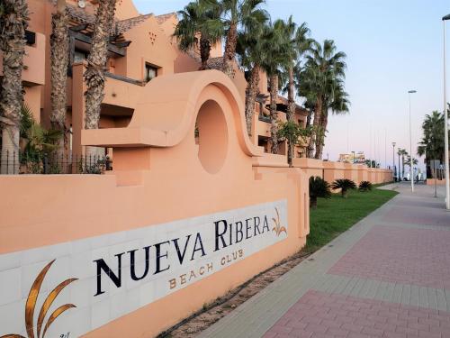 un edificio con una señal que dice nivea rifergas en Casa Javier - A Murcia Holiday Rentals Property, en Los Alcázares