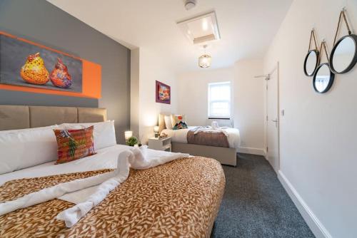En eller flere senger på et rom på Jesouth Refreshing Condo Roomy Comfy Posh
