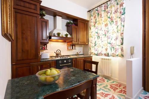 A kitchen or kitchenette at Delfini Trevi House