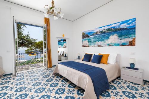 a bedroom with a bed and a large window at Villa Fedora Sea&Stars in Massa Lubrense