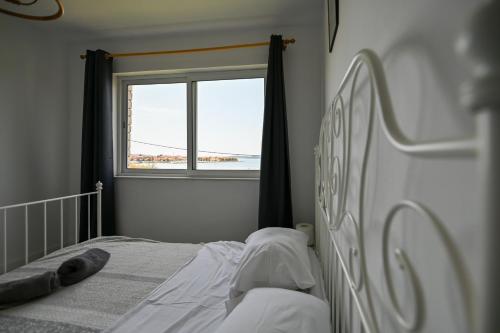 Katil atau katil-katil dalam bilik di Apartmani Frleta