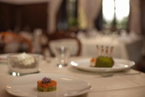 a table with two plates of food on it at VILA HERBERSTEIN in Velenje