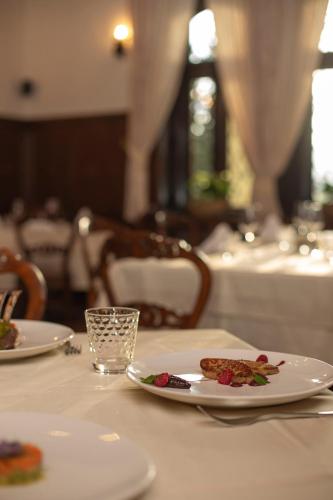a table with two plates of food on top of it at VILA HERBERSTEIN in Velenje