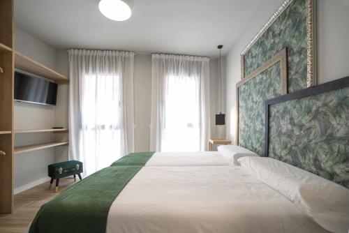 A bed or beds in a room at Apto rural Alesves Esencia de Bardenas Navarra
