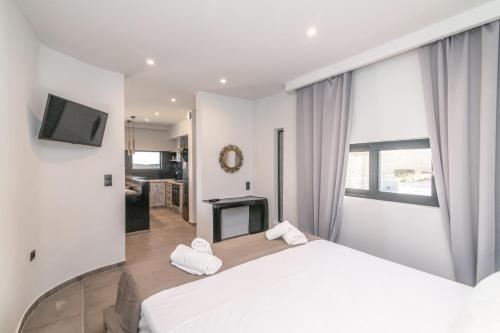 Postel nebo postele na pokoji v ubytování Sunset junior suites