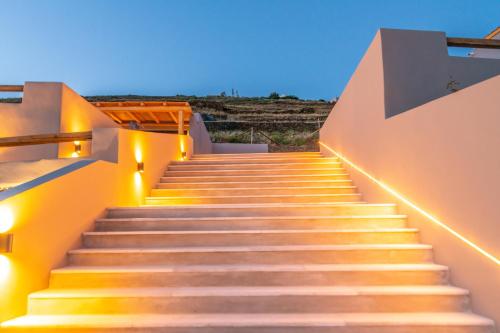 a set of stairs with lights on them at Sunset junior suites in Agios Ioannis Tinos