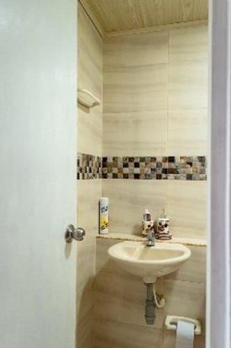 a bathroom with a white sink in a room at Casa 39-33 in Cartagena de Indias