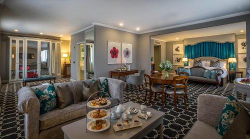 a living room with a couch and a table at Castletroy Park Hotel in Limerick