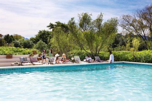 people in a swimming pool at Spier Hotel and Wine Farm in Stellenbosch