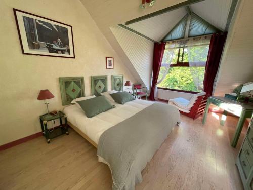 A bed or beds in a room at La Corne de Cerf, Forêt de Brocéliande