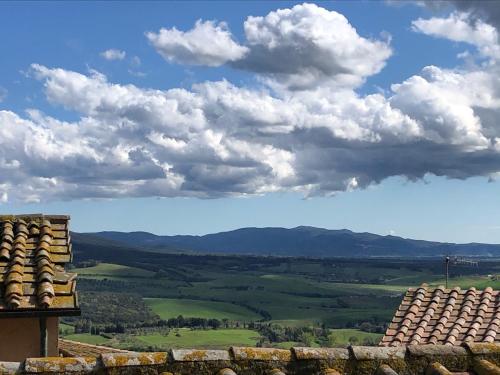 a view of the countryside from the roof of a building at In piazza Casale Marittimo in Casale Marittimo