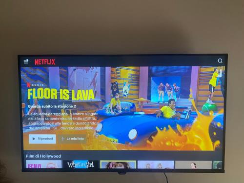 Et tv og/eller underholdning på Olea Seaside Apartment