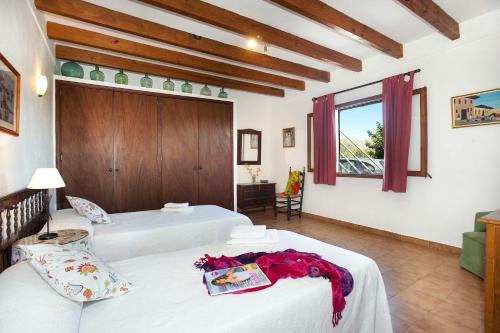 מיטה או מיטות בחדר ב-Villa Can Pinto by Villa Plus