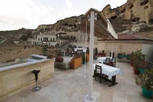 a restaurant with a mural of a mountain at Urgup Konak Hotel in Urgup