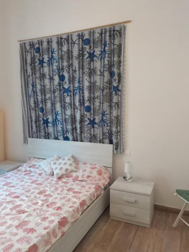 Ένα ή περισσότερα κρεβάτια σε δωμάτιο στο Bilocale primo piano