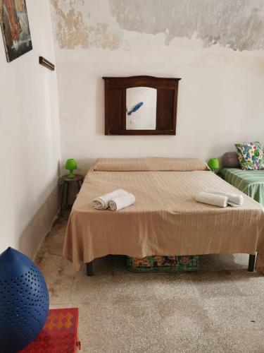 Llit o llits en una habitació de Santino Casa
