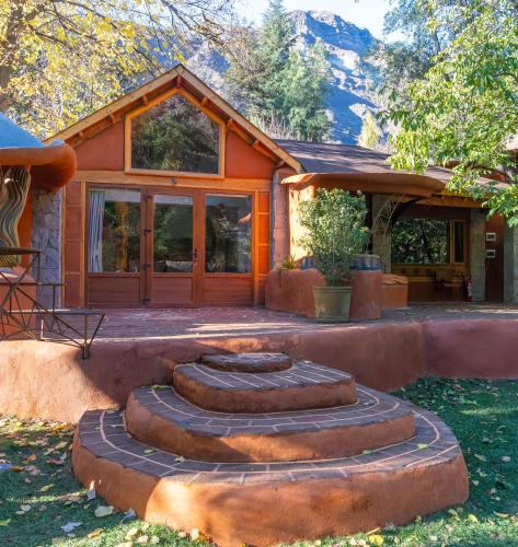 a house with a bunch of tires in front of it at Casa Primal in San José de Maipo