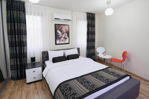 Cama o camas de una habitación en Millenium Travel Apartments