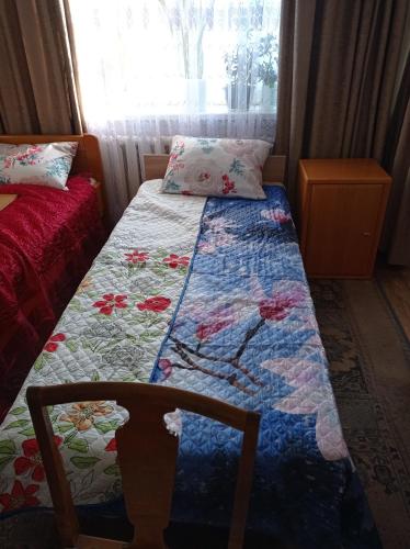 Postel nebo postele na pokoji v ubytování Tirgus iela 2