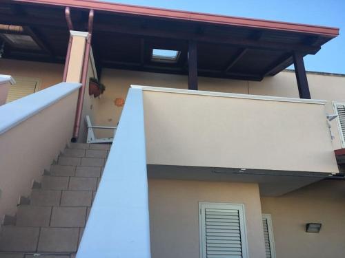 a stairway leading up to a building with a stair case at Casa stella marina in Campomarino