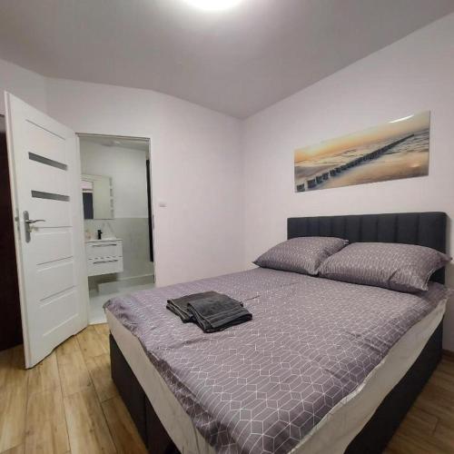 Posteľ alebo postele v izbe v ubytovaní Apartament MIRA