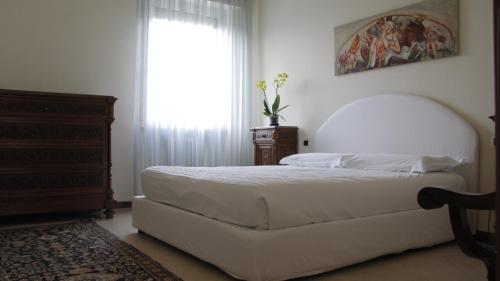 מיטה או מיטות בחדר ב-Casa Farinati
