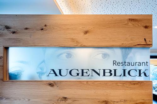 a sign with the words restaurant alexxualappelicked at Hotel Kühberg in Oberstdorf