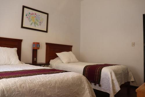 Postel nebo postele na pokoji v ubytování Casa Gabriel