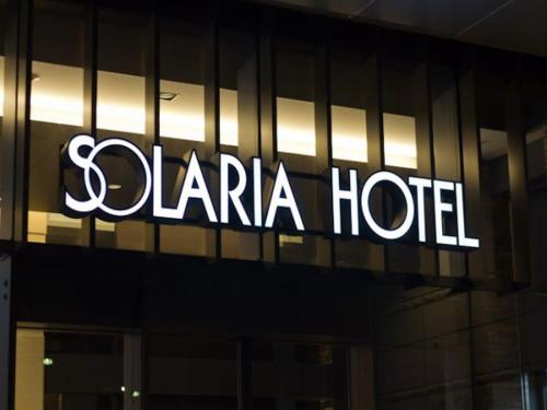a clara hotel sign on the side of a building at Solaria Nishitetsu Hotel Kagoshima in Kagoshima