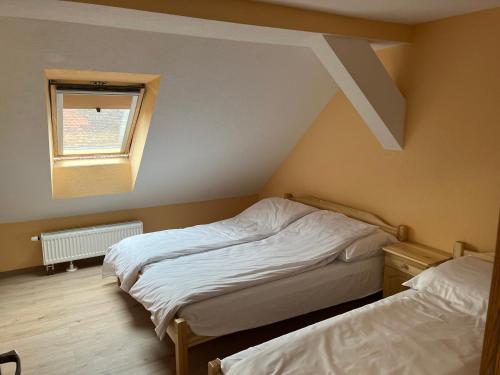 Postel nebo postele na pokoji v ubytování VT6 House & Restaurant